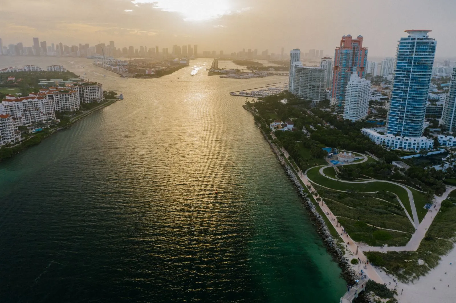 Aerial view of Miami Beach's coastline and the downtown Miami skyline at sunset